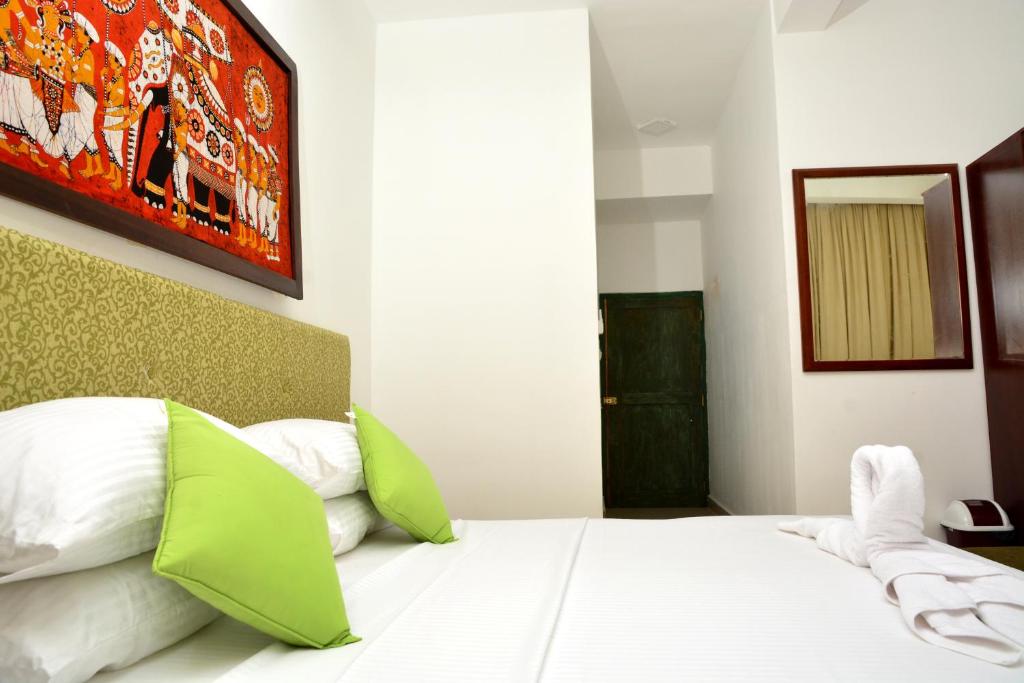 Postel nebo postele na pokoji v ubytování Green Ayurvedic Beach Resort