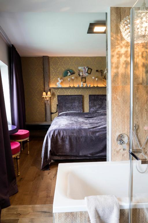Postel nebo postele na pokoji v ubytování Boutique Hotel im Auracher Löchl