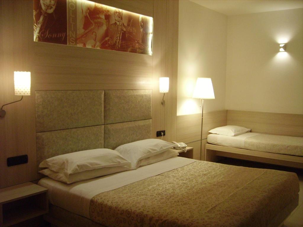 Postel nebo postele na pokoji v ubytování Hotel Degli Haethey