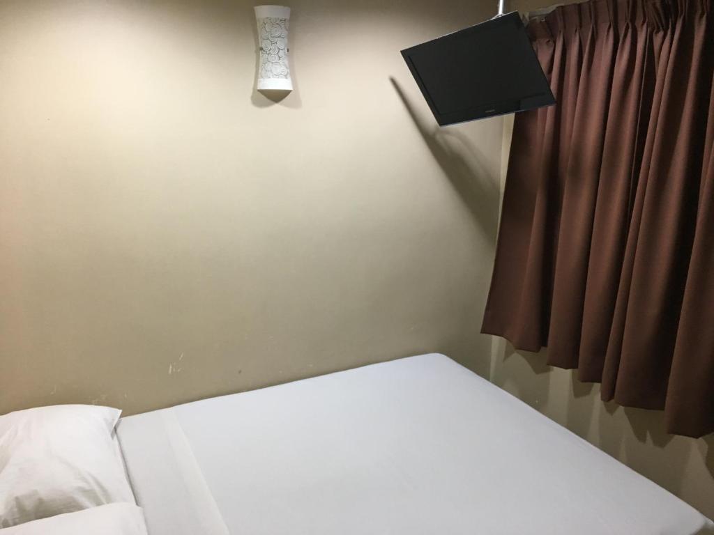 Postel nebo postele na pokoji v ubytování Pantai GuestHouse