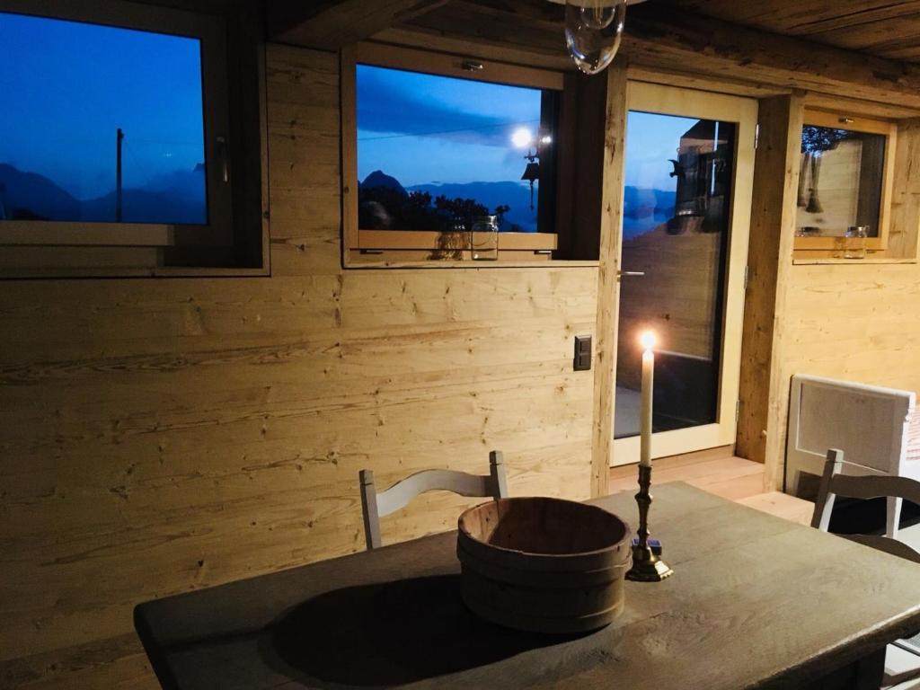 a kitchen with a sink in a room with windows at Giferspitz Gstaad in Gstaad