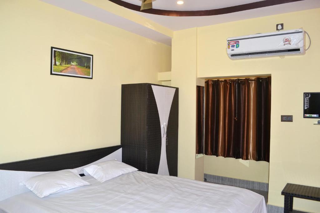 Voodi või voodid majutusasutuse New Mukherjee Lodge toas