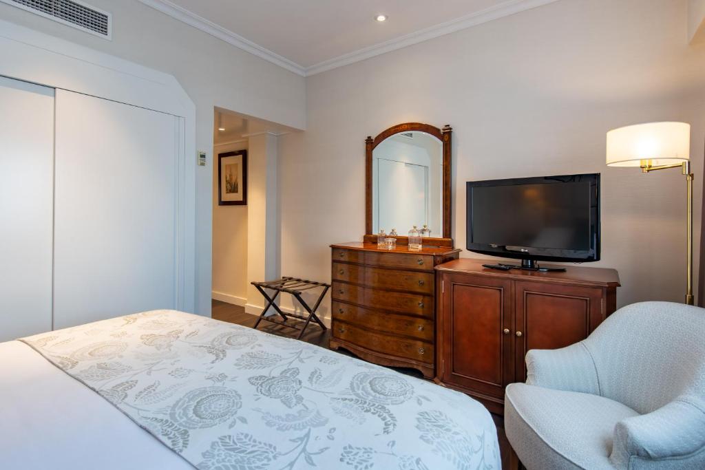 Uma cama ou camas num quarto em Hotel Praga