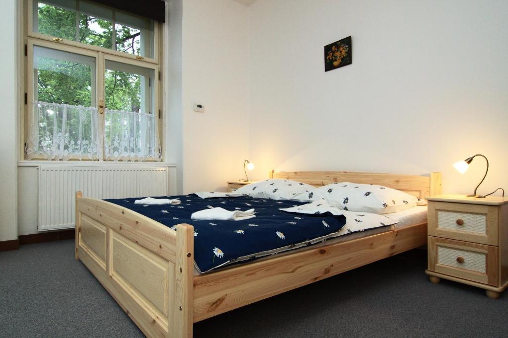 Postel nebo postele na pokoji v ubytování Hotel Pod Sluncem