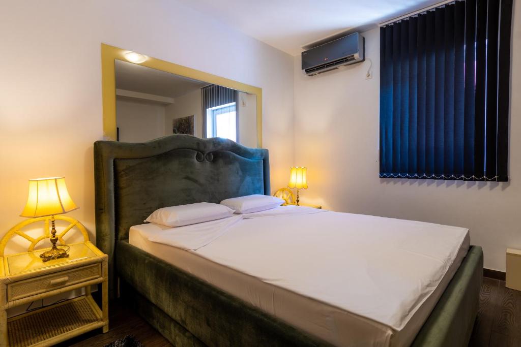 Postel nebo postele na pokoji v ubytování Olympic Wellness & Spa Hotel