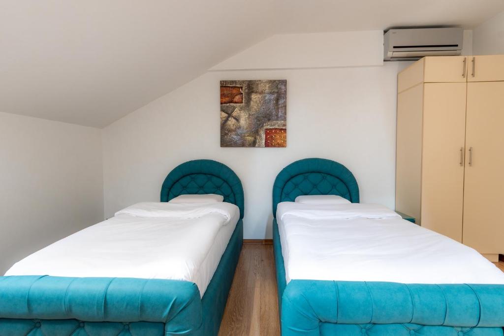 Postel nebo postele na pokoji v ubytování Olympic Wellness & Spa Hotel
