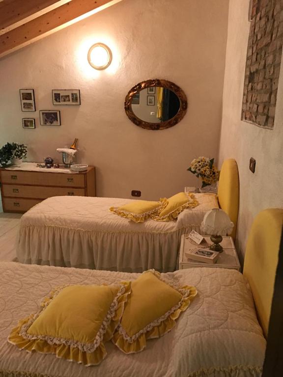 Postel nebo postele na pokoji v ubytování Villa Camilla