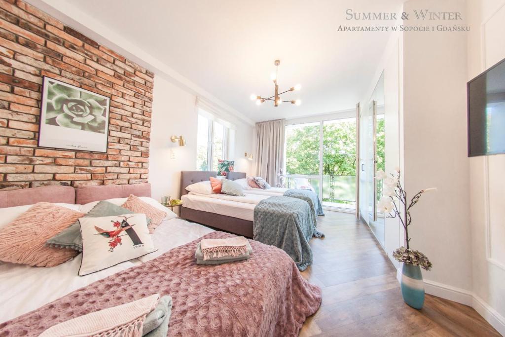 Posteľ alebo postele v izbe v ubytovaní Family Luxury Pure Old Town Apartament 1-8, 2 sypialnie i salon, parking pub, 60m2