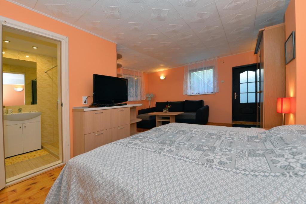 Postel nebo postele na pokoji v ubytování Nida guesthouse at Loreta
