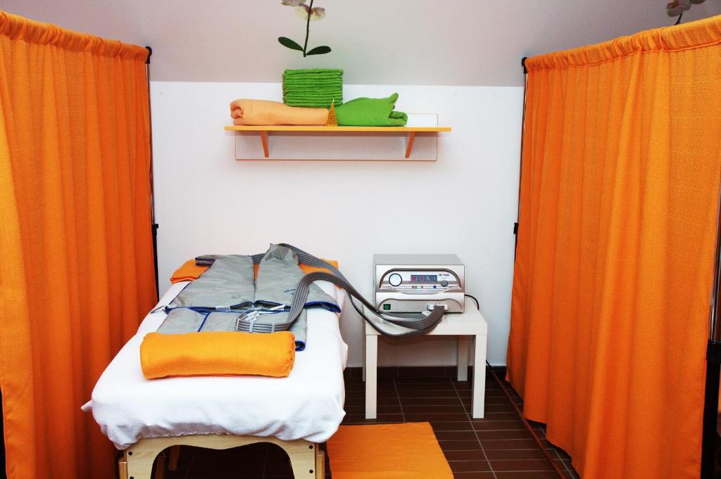 Postel nebo postele na pokoji v ubytování Hotel Pod Sluncem