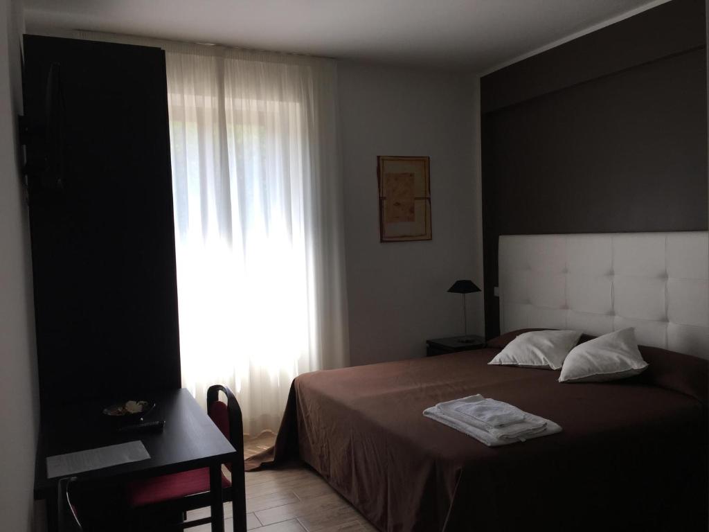 Łóżko lub łóżka w pokoju w obiekcie Itaka