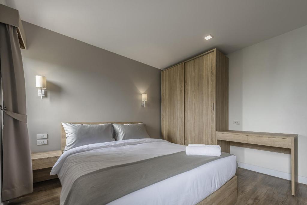 Postel nebo postele na pokoji v ubytování Carnation Residence
