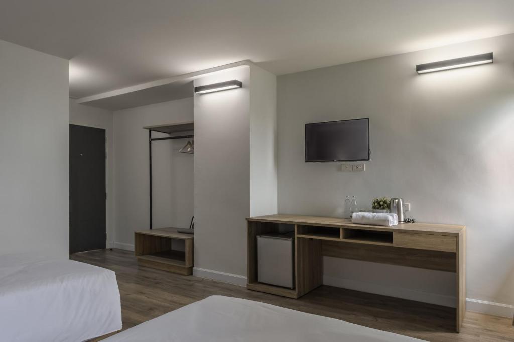Postel nebo postele na pokoji v ubytování Carnation Residence