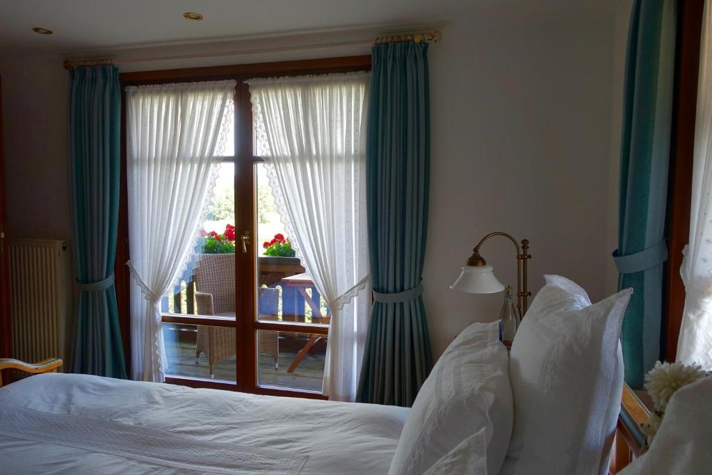 Postel nebo postele na pokoji v ubytování Hollhouse - Bed & Breakfast