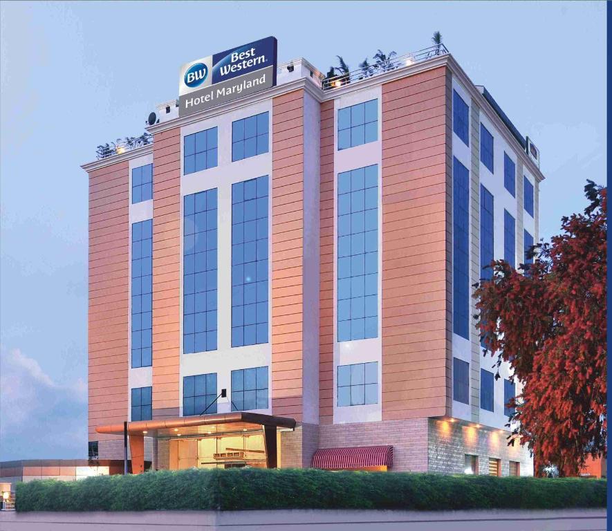 a building with a sign on top of it at Best Western Maryland Hotel in Chandīgarh