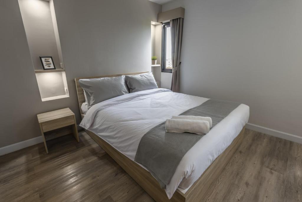 Postel nebo postele na pokoji v ubytování Carnation Residence