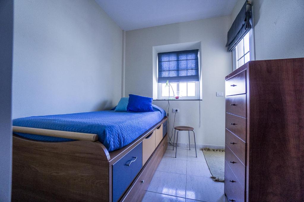 Postel nebo postele na pokoji v ubytování Rooms in El Medano