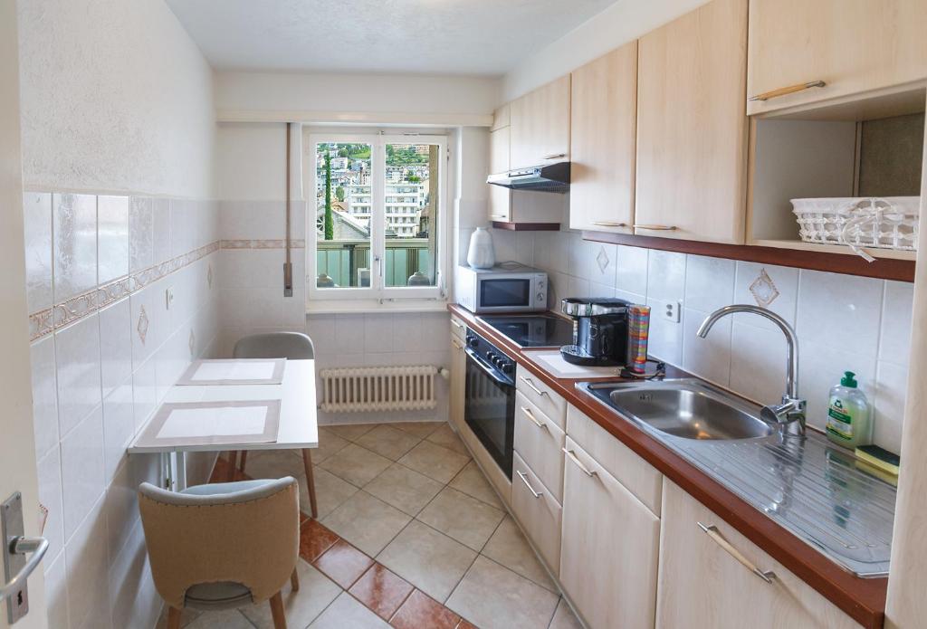Kuchyň nebo kuchyňský kout v ubytování Central Apartment with Terrace