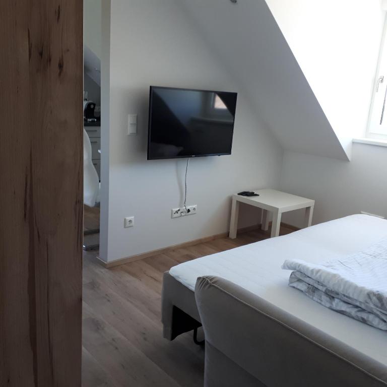 TV a/nebo společenská místnost v ubytování Ferienwohnung Weigert