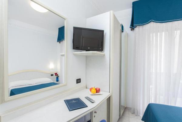 TV a/nebo společenská místnost v ubytování Hotel Oriente