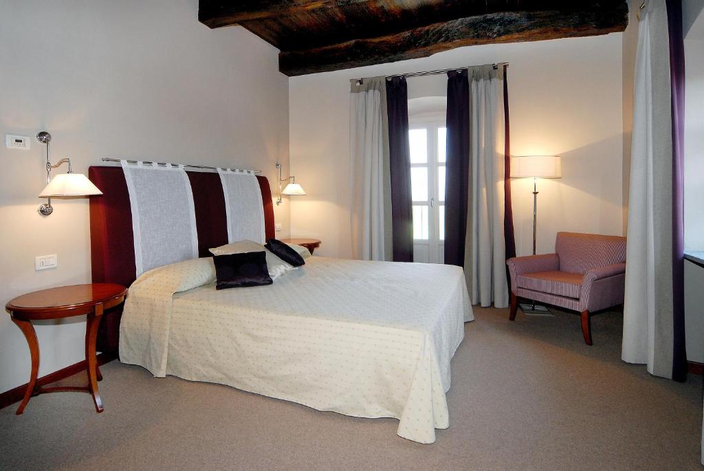 Postel nebo postele na pokoji v ubytování Hotel Antico Podere Propano