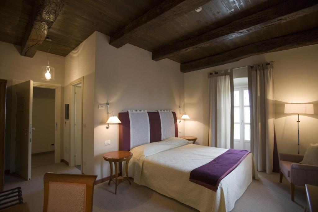 Postel nebo postele na pokoji v ubytování Hotel Antico Podere Propano