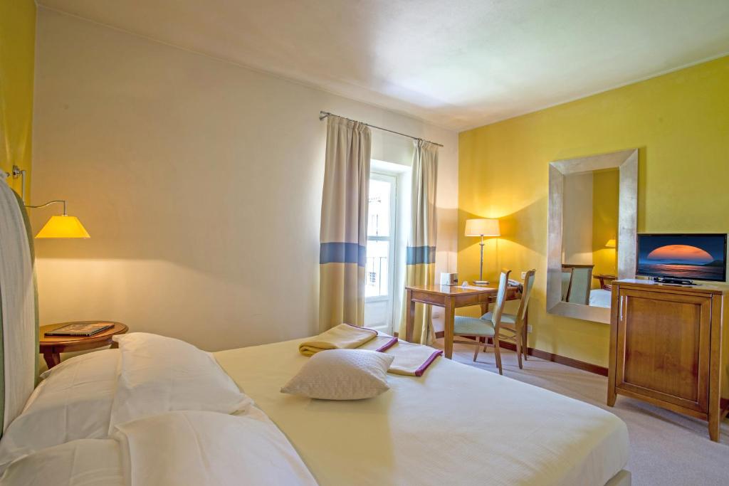 Postel nebo postele na pokoji v ubytování Hotel Antico Podere Propano