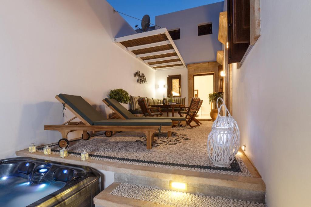 a living room with a couch and a table at Lindos Vista Luxury Villa in Lindos