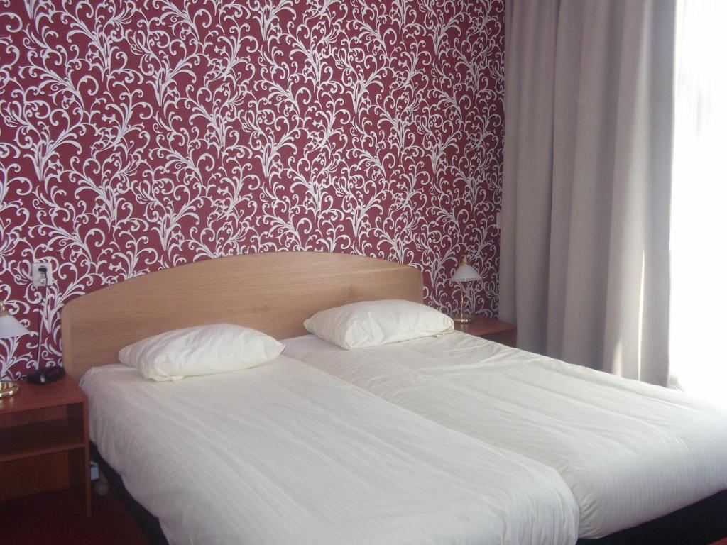 Postel nebo postele na pokoji v ubytování Die Port van Cleve