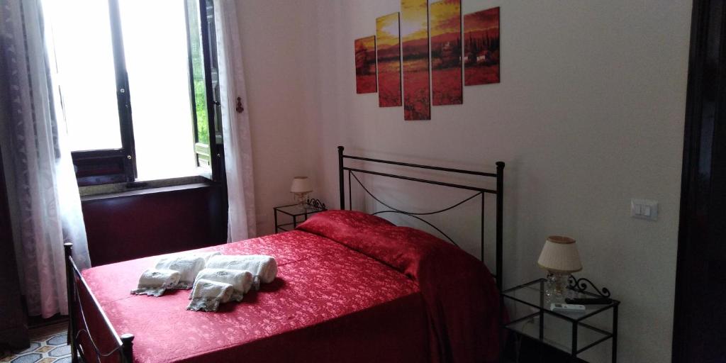 Łóżko lub łóżka w pokoju w obiekcie Villa le Torri B&B