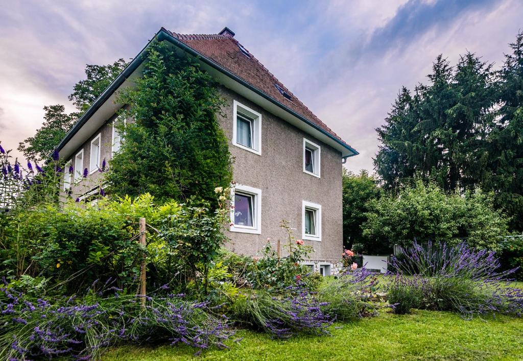 a house with ivy growing on the side of it at Domizil Familiär in Graz