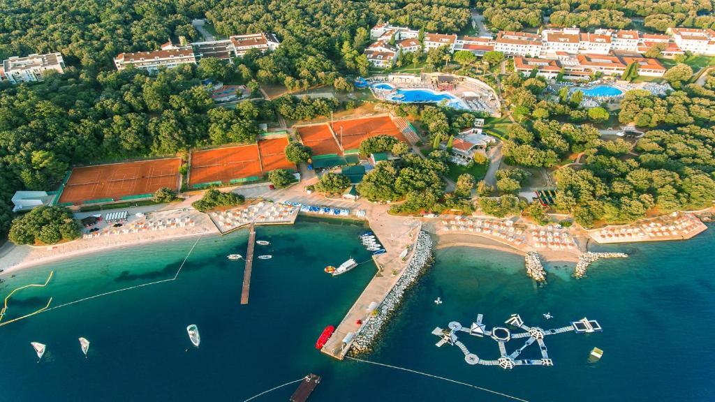 an aerial view of a resort with boats in the water at Valamar Tamaris Resort in Poreč