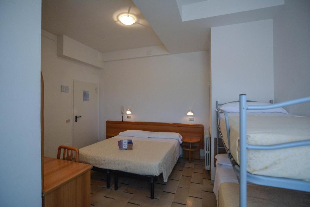 Postel nebo postele na pokoji v ubytování Hotel Zani