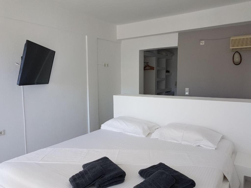 Postel nebo postele na pokoji v ubytování Lagada Beach Hotel
