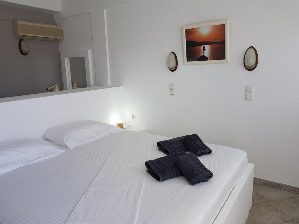 Postel nebo postele na pokoji v ubytování Lagada Beach Hotel