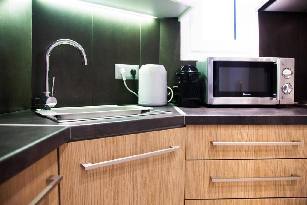 A kitchen or kitchenette at TONI'S Classy Home in Kolonaki, local's Gem