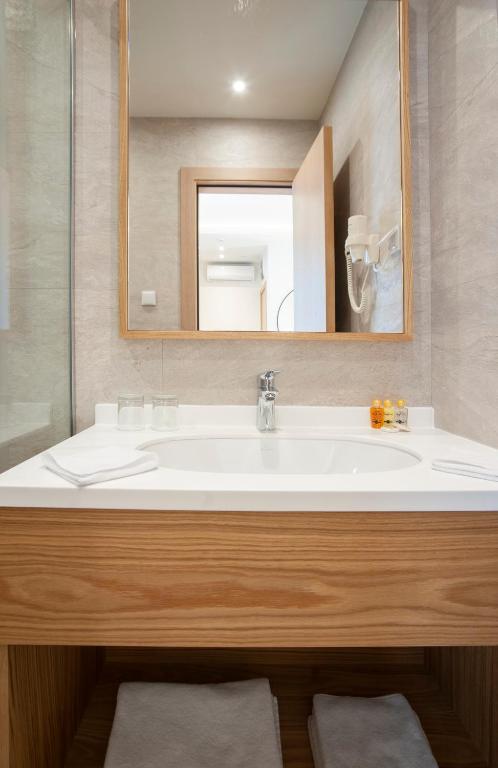 a bathroom with a white sink and a mirror at Hotel Villa Gracia in Budva