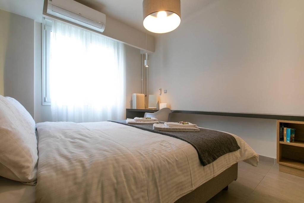 Postel nebo postele na pokoji v ubytování TONI'S Studio Syntagma, 1 min from Metro station