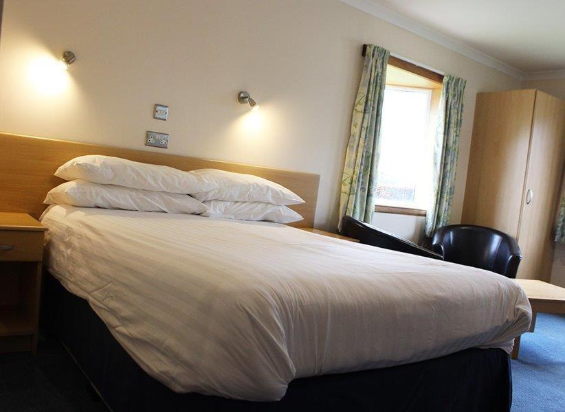 Postel nebo postele na pokoji v ubytování Sky Lodge Perth