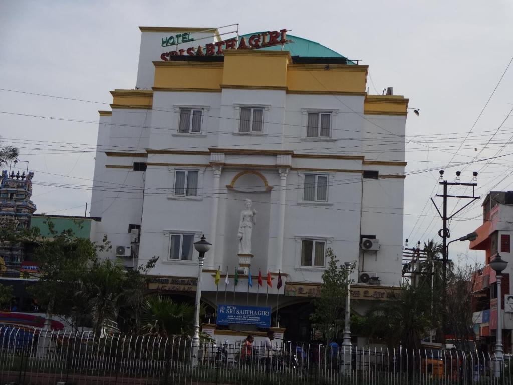 a building with a sign on top of it at Hotel Sri Sabthagiri in Puducherry