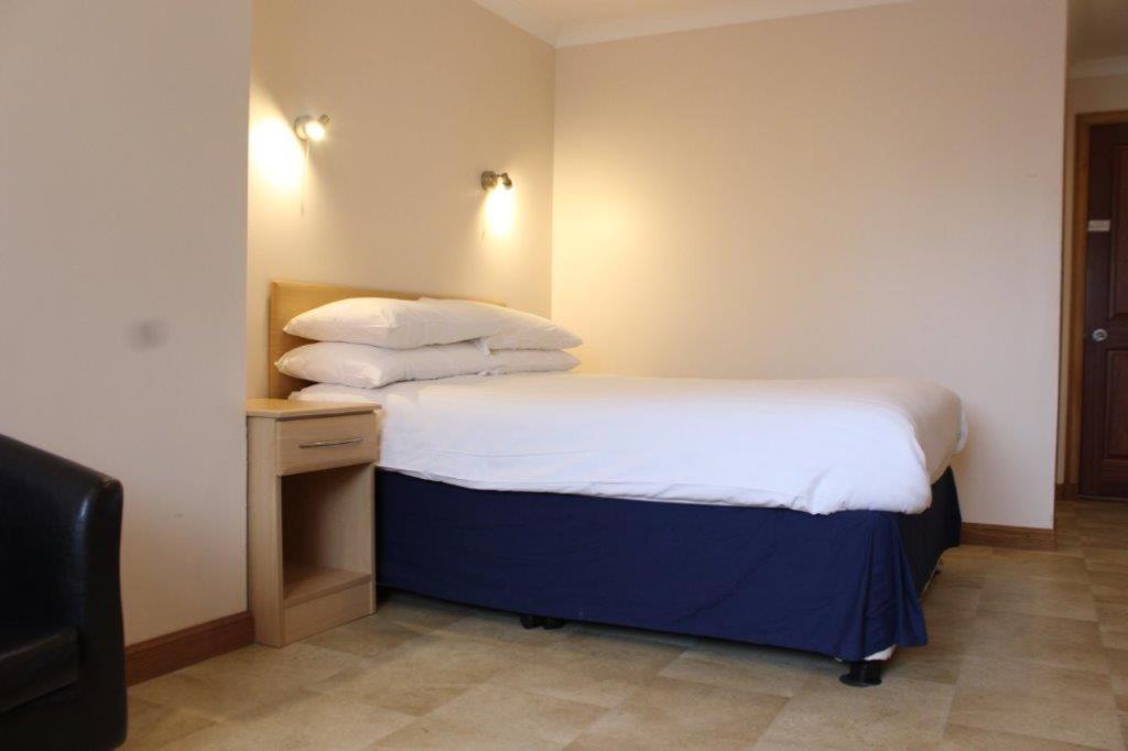 Postel nebo postele na pokoji v ubytování Sky Lodge Perth