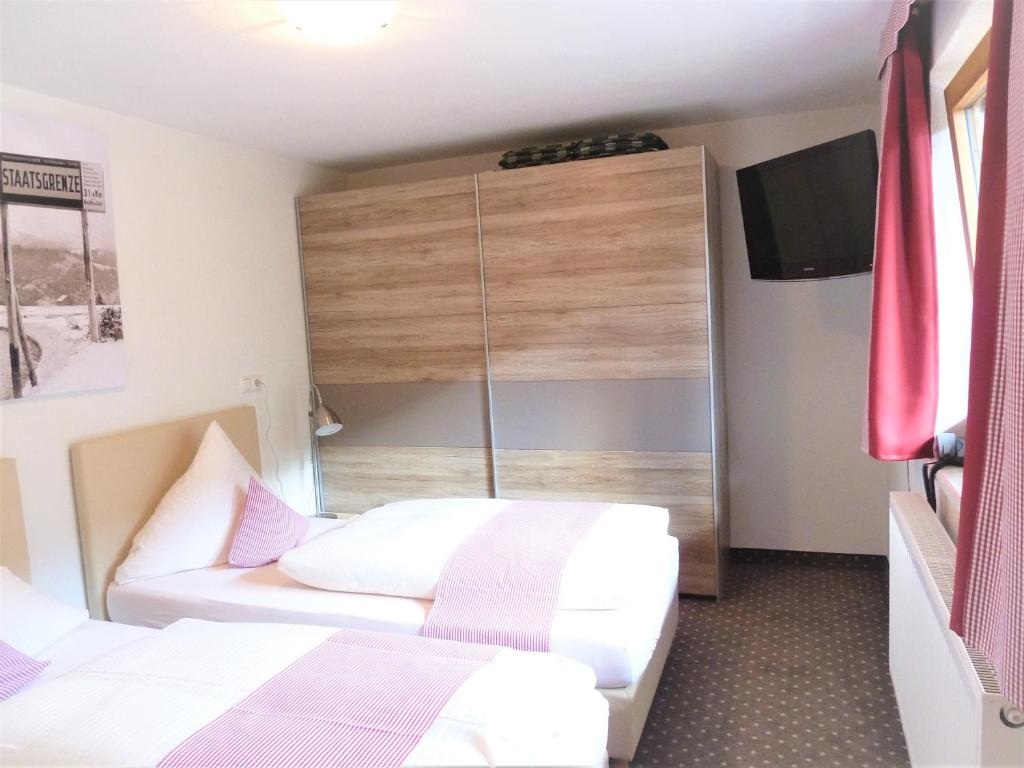 Postel nebo postele na pokoji v ubytování Alpina Appartements