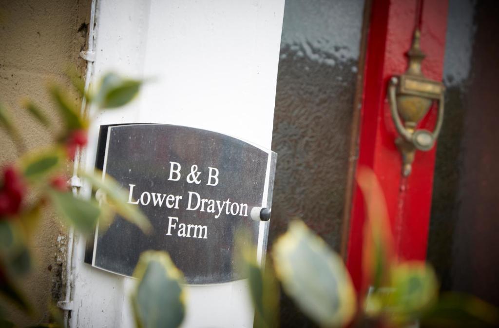 a sign that says lower elevation farm on a door at Lower Drayton Farm B&B in Stafford