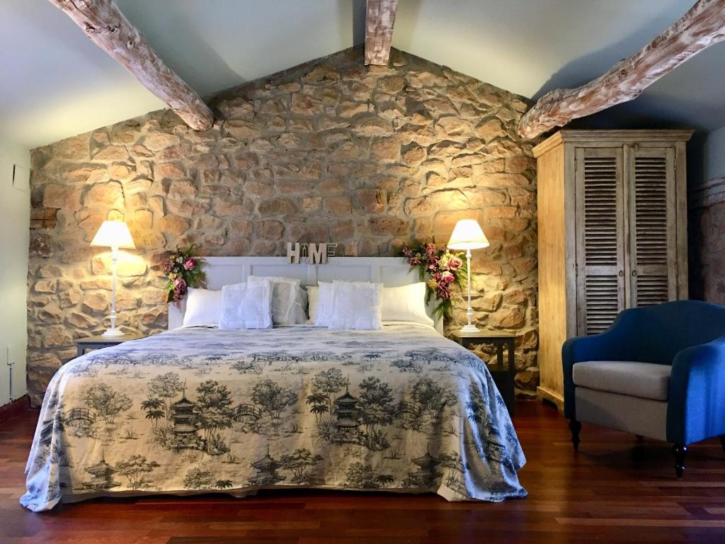 A bed or beds in a room at Doña Palmira