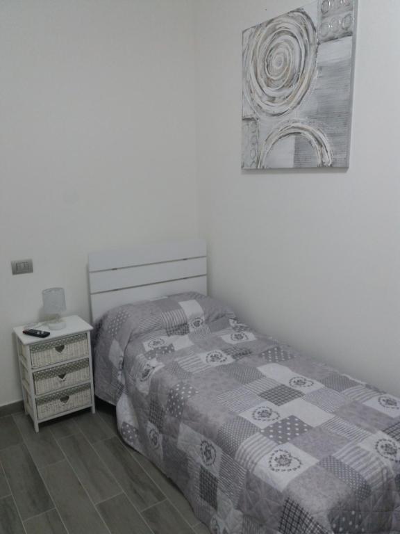 Postel nebo postele na pokoji v ubytování Affittacamere Il Borgo