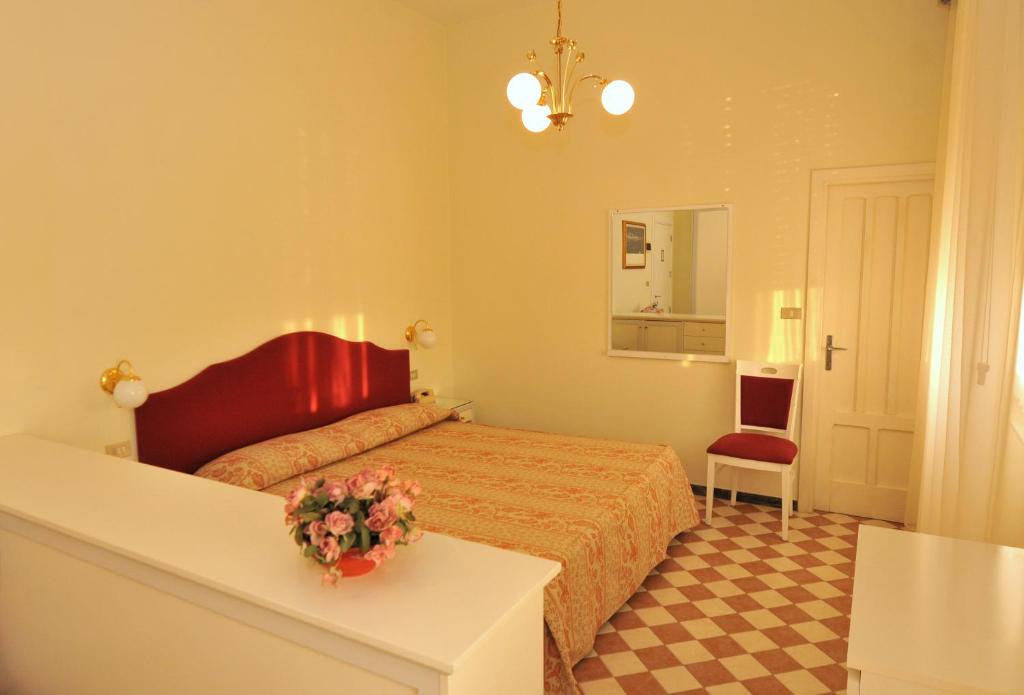 Postel nebo postele na pokoji v ubytování Hotel Britannia