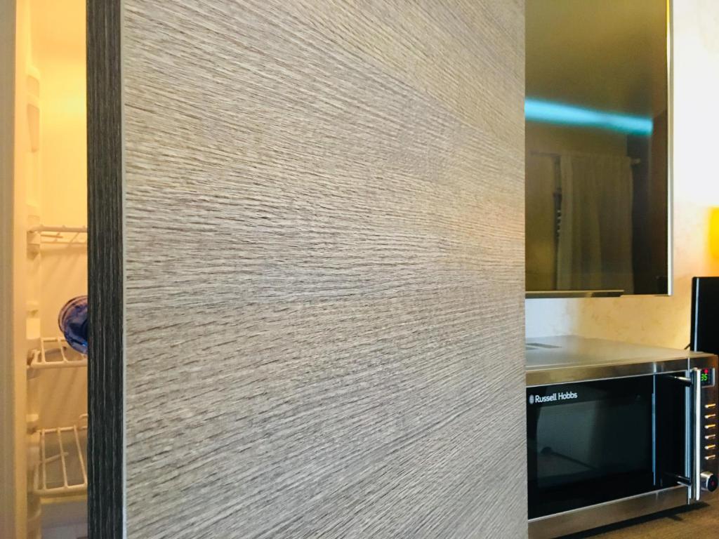 Televízia a/alebo spoločenská miestnosť v ubytovaní Eschilo Luxury House