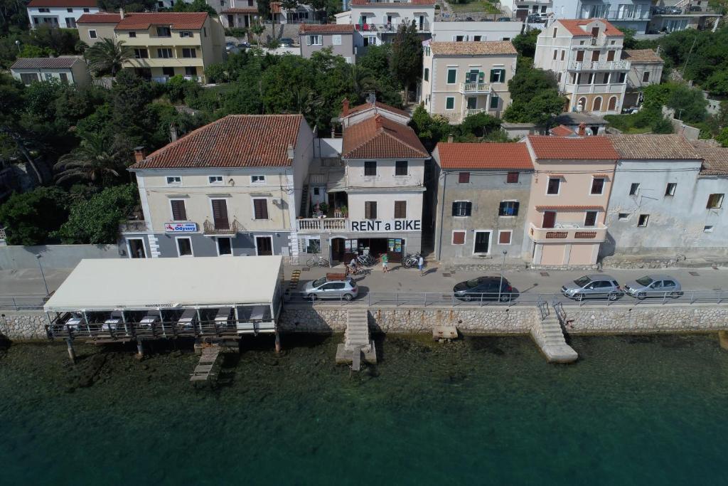 a view of a city with cars parked in the water at Pleasant apartment with Seaview in Mali Lošinj