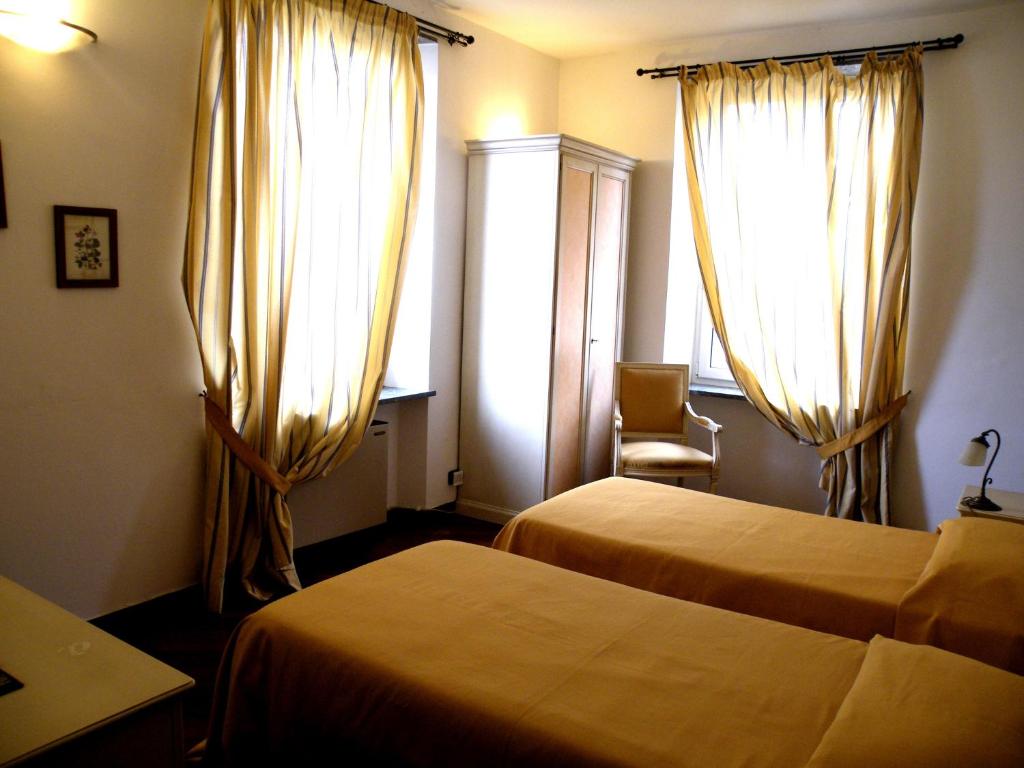 Postel nebo postele na pokoji v ubytování Albergo Birra