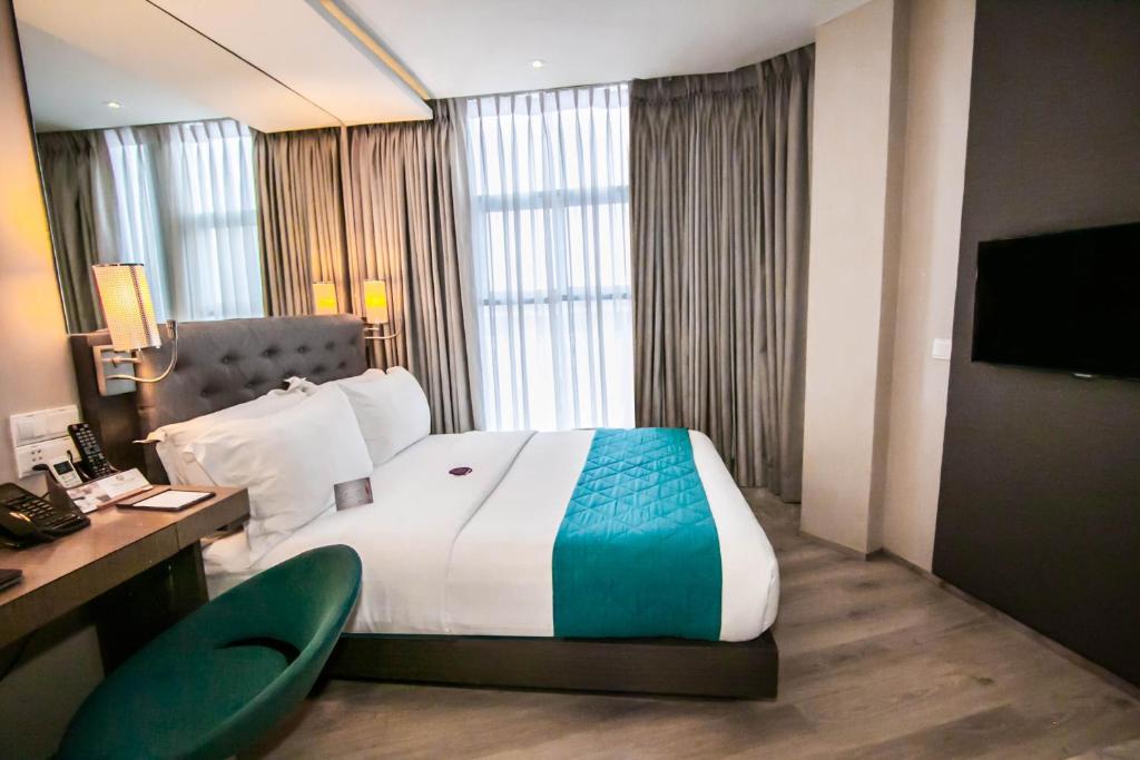 Postel nebo postele na pokoji v ubytování Hotel XYZ